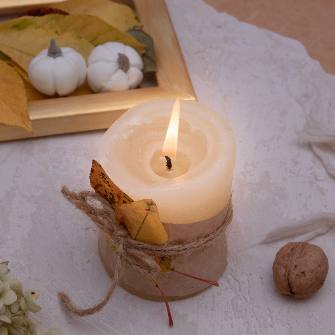 autumn-vintage-still-life-with-fallen-leaves-candles-knitted-blanket-autumn-atmosphere-concept.jpg