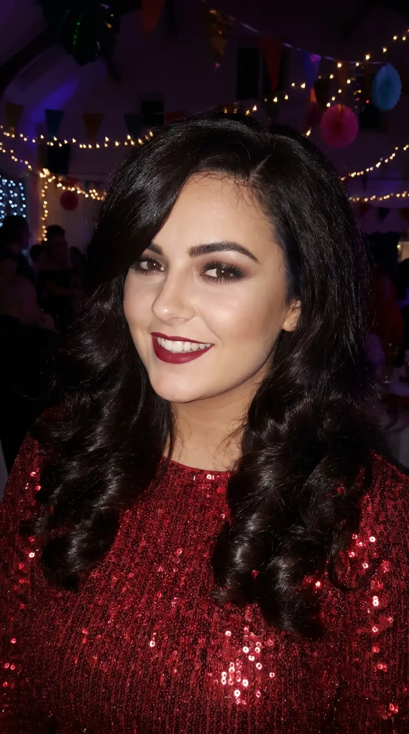 Woman with long black brown glamorous curl blowout hair