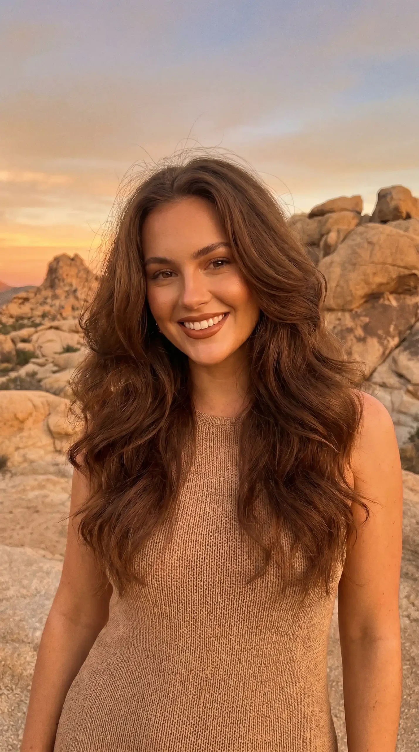Woman with medium cocoa brown bouncy curl blowout hair