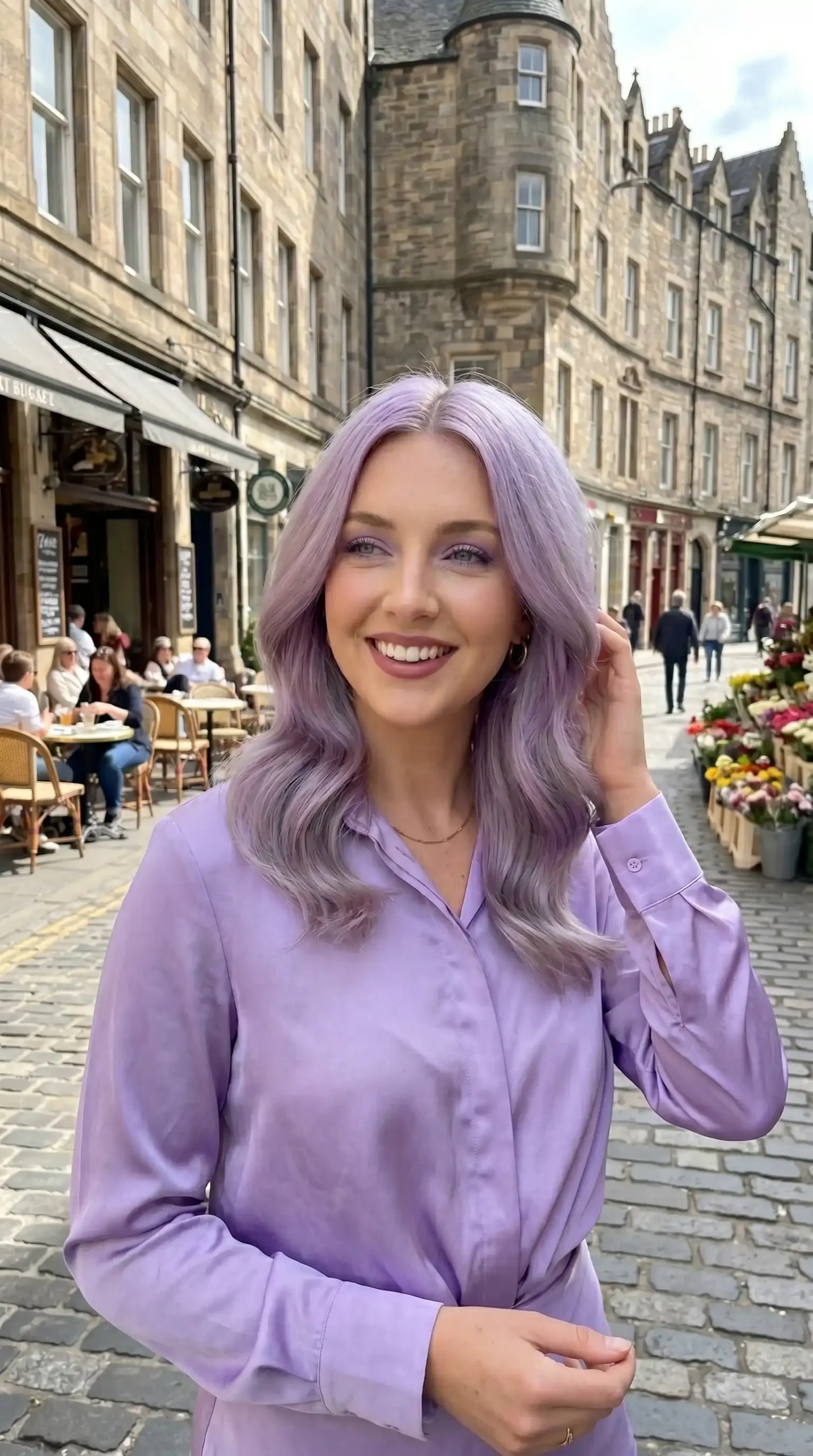 Woman with medium lavender ash soft wave blowout hair