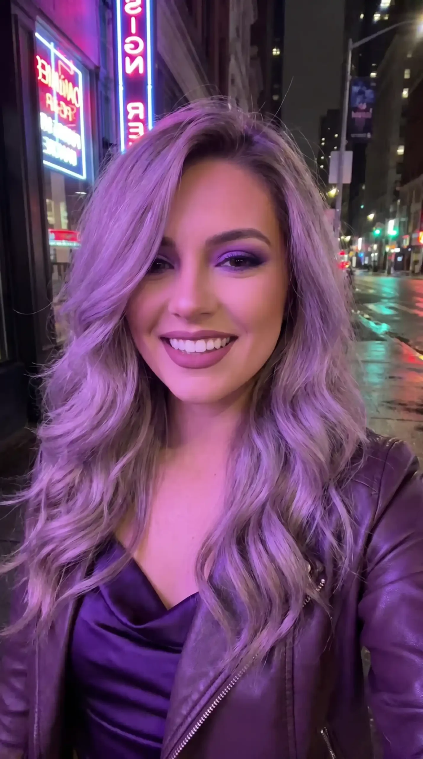 Woman with long violet ash soft wave blowout hair