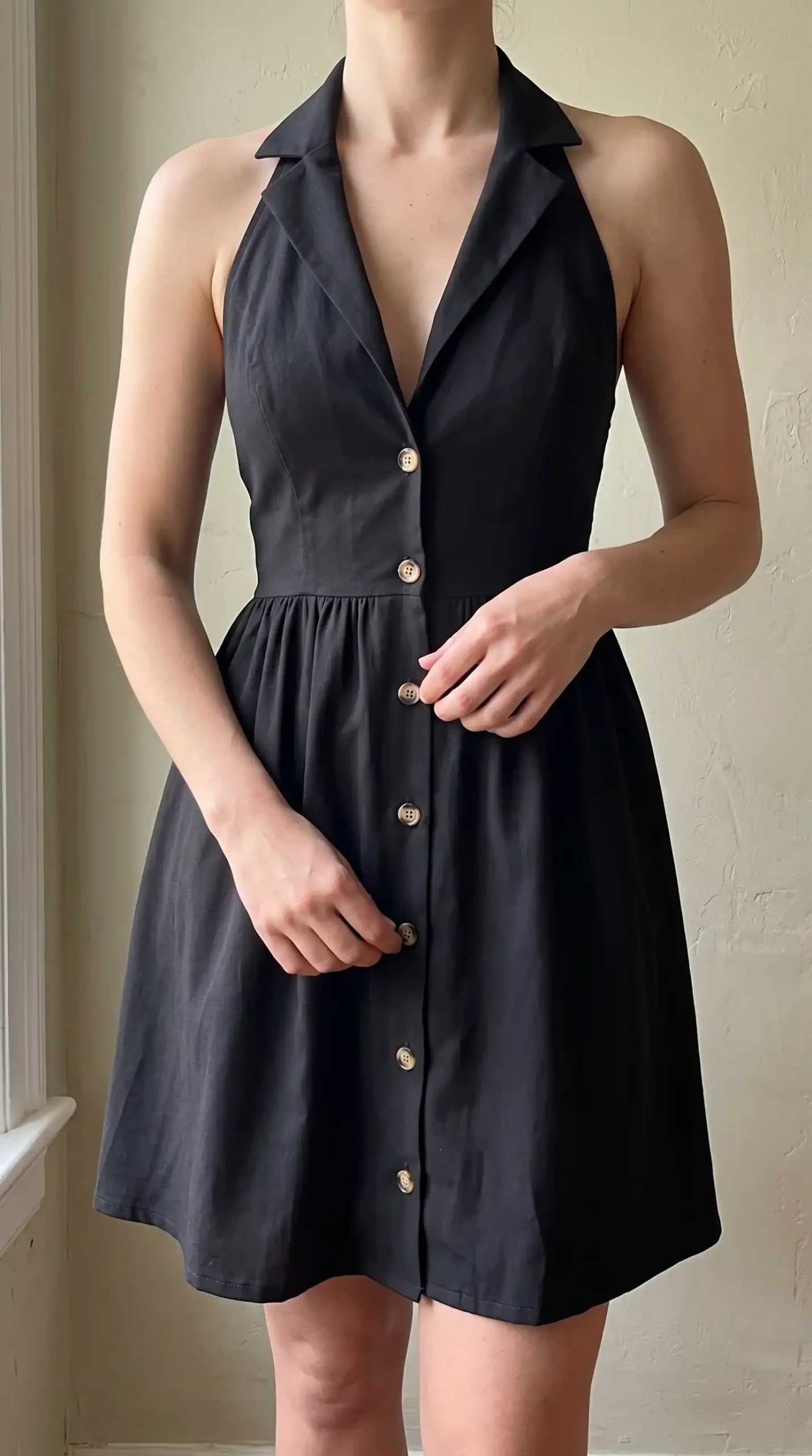 Black halter collar button front fit and flare mini dress indoors spring