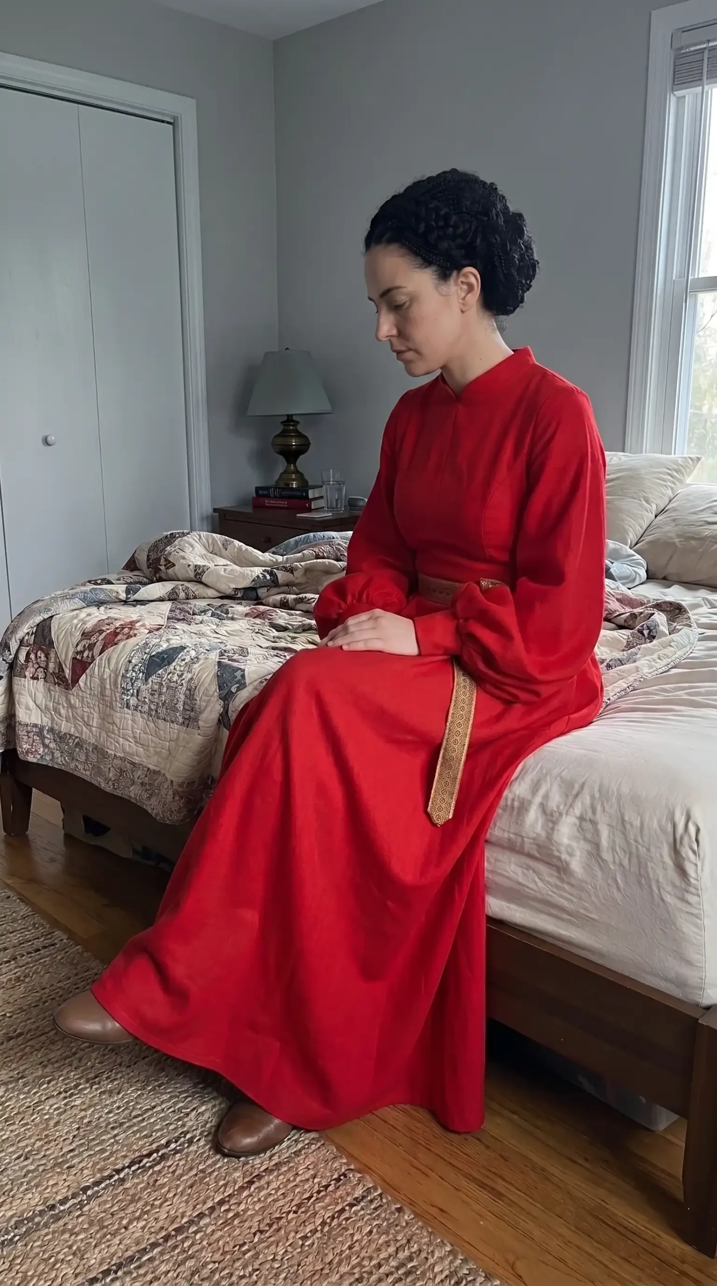 Woman dressed as Buttercup from The Princess Bride in crimson red long sleeve high neck maxi dress