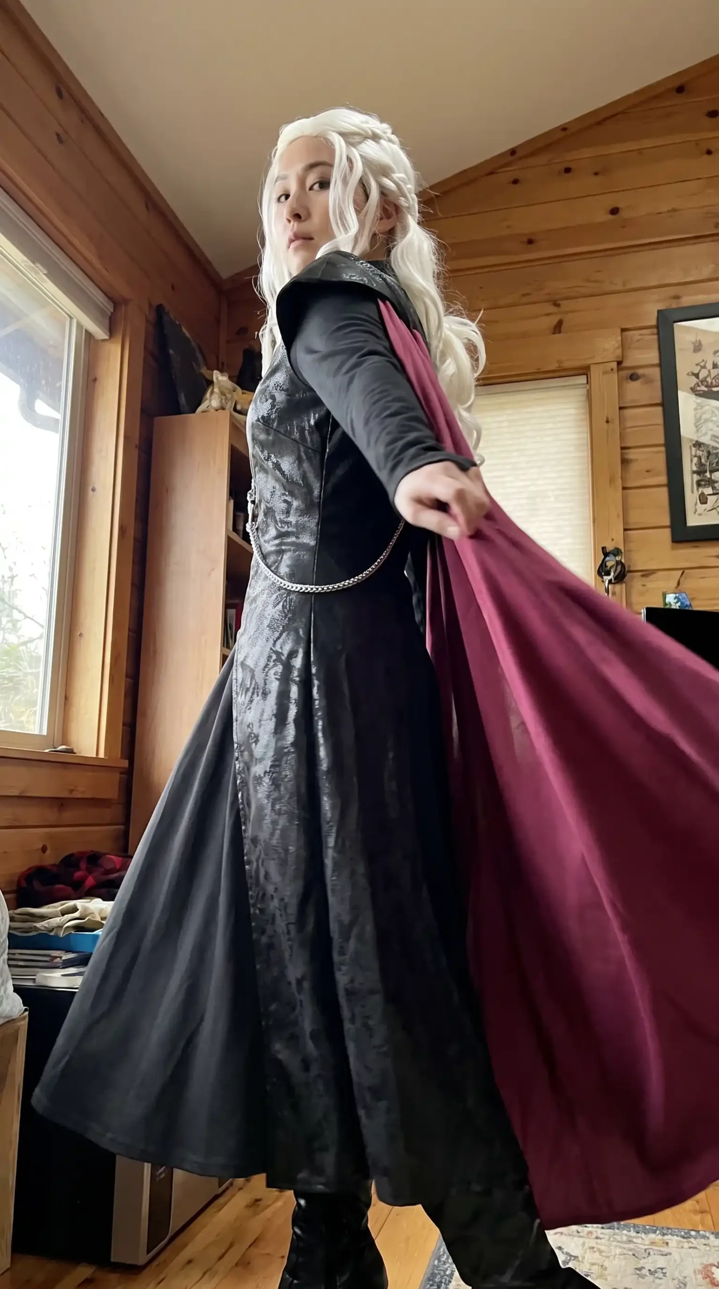 Woman dressed as Daenerys Targaryen from Game of Thrones in black textured brocade maxi dress