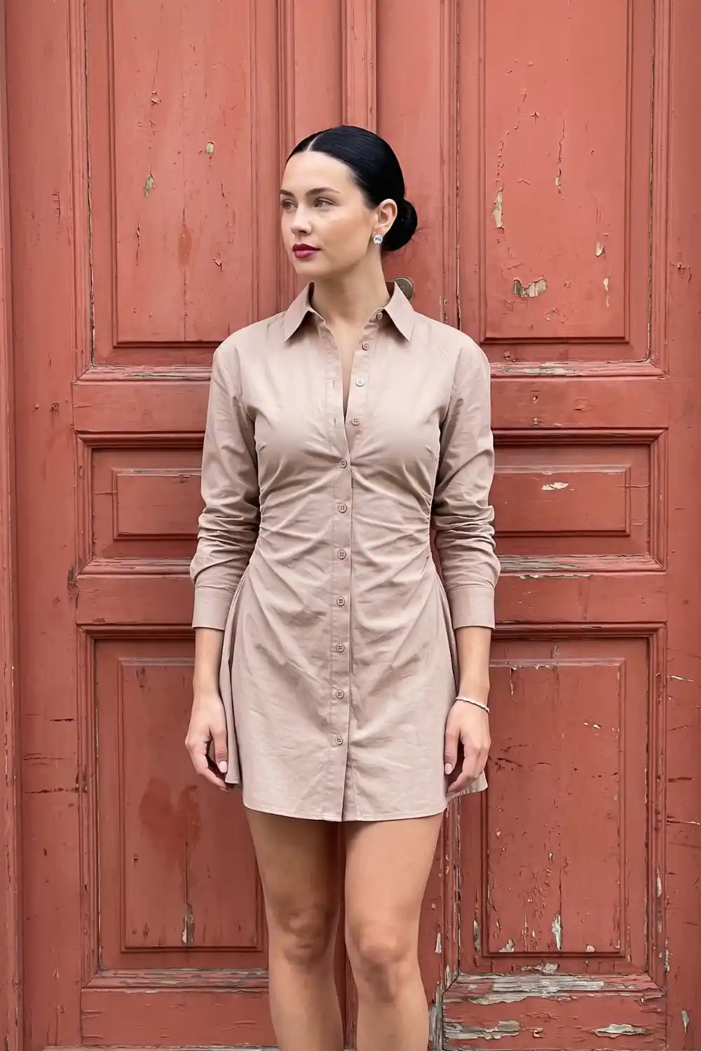Woman wearing beige mocha fitted long sleeve mini shirt dress