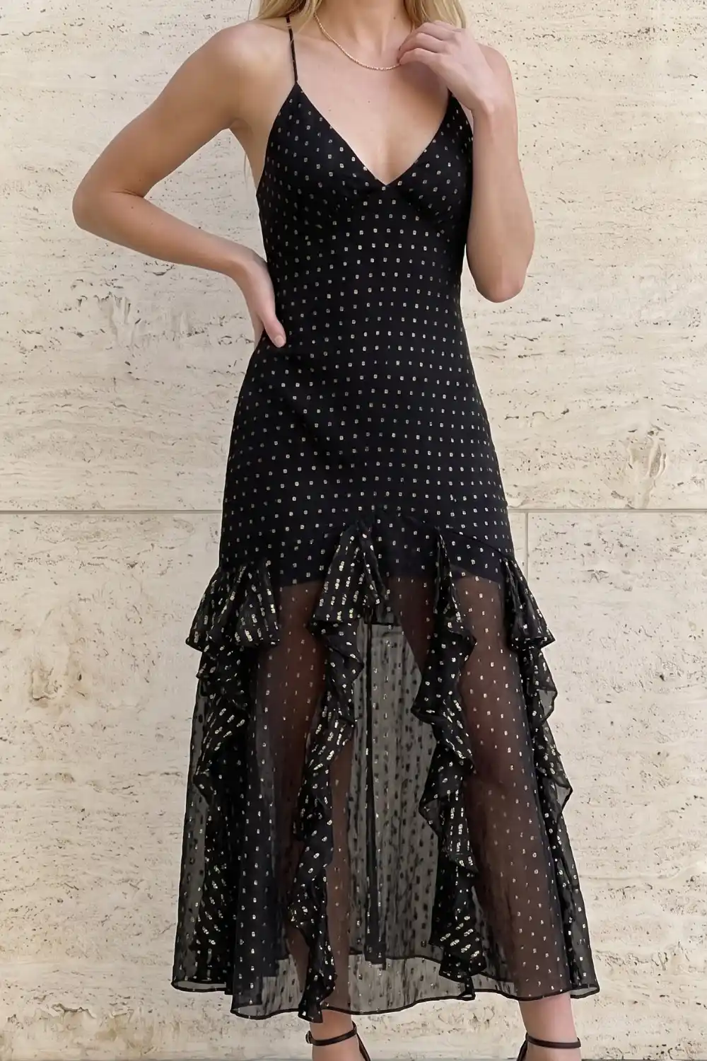 Woman wearing black gold metallic dot sheer ruffle hem midi dress
