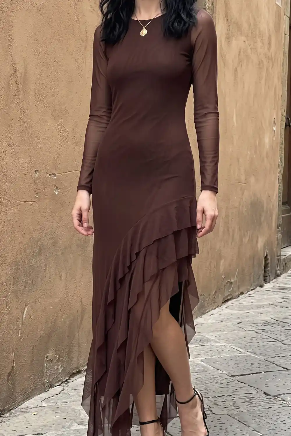 Woman wearing brown mesh long sleeve ruffle hem maxi dress