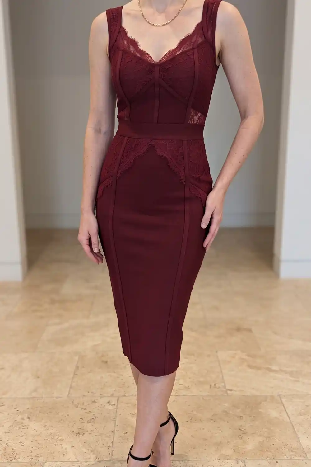 Woman wearing burgundy lace trim sweetheart bodycon midi dress