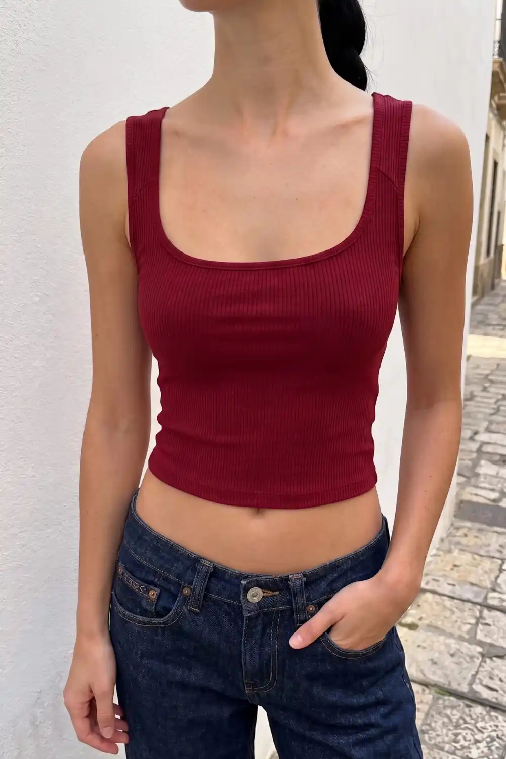 Woman wearing burgundy ribbed square neck crop tank top