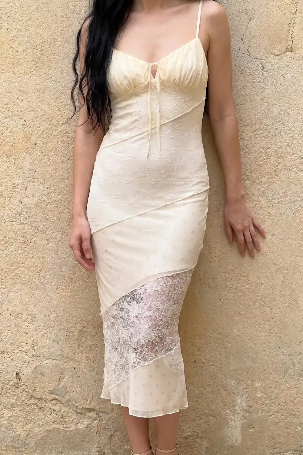 Woman wearing cream lace panel tie front midi dress