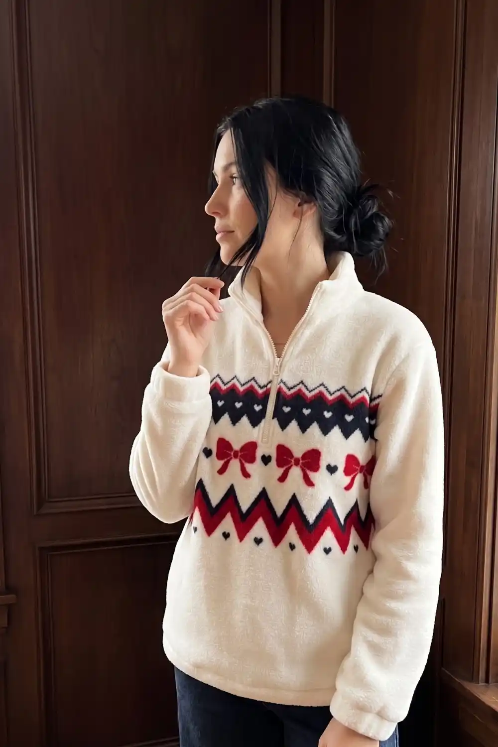 Woman wearing cream sherpa bow heart fair isle quarter zip fleece pullover