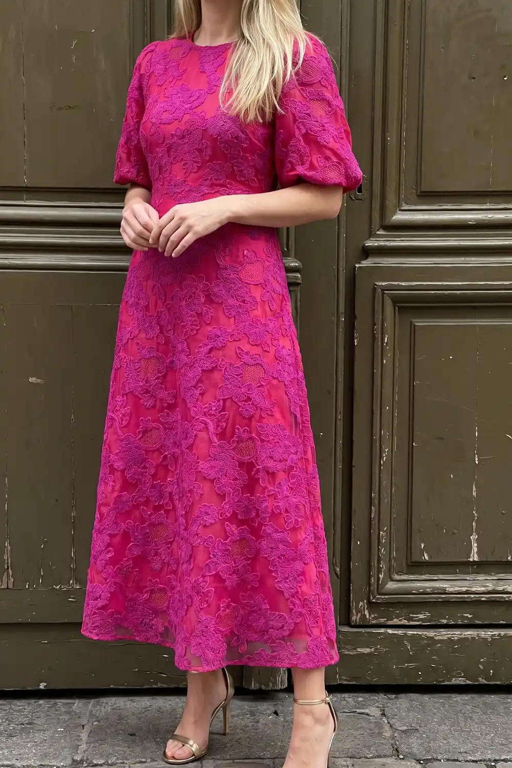 Woman wearing hot pink floral lace puff sleeve midi dress