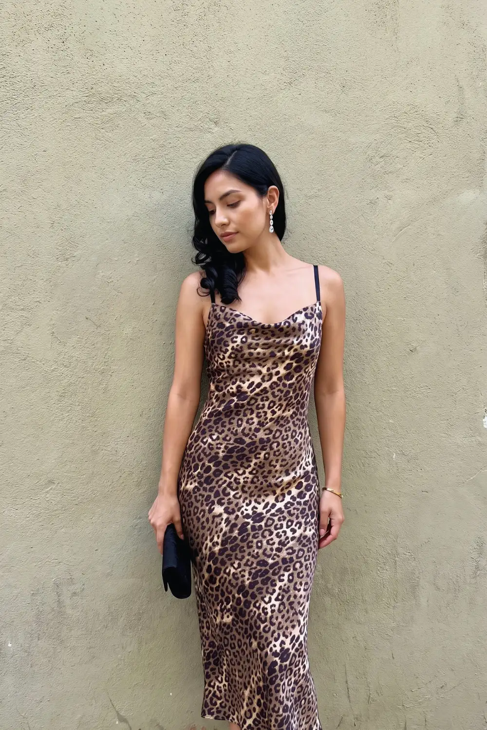 Woman in brown tan leopard print satin cowl neck slip midi dress