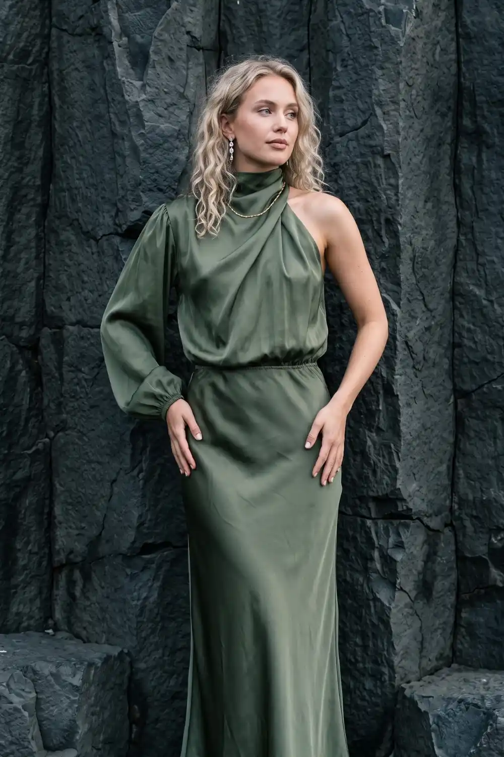 Woman in olive green satin one shoulder maxi dress
