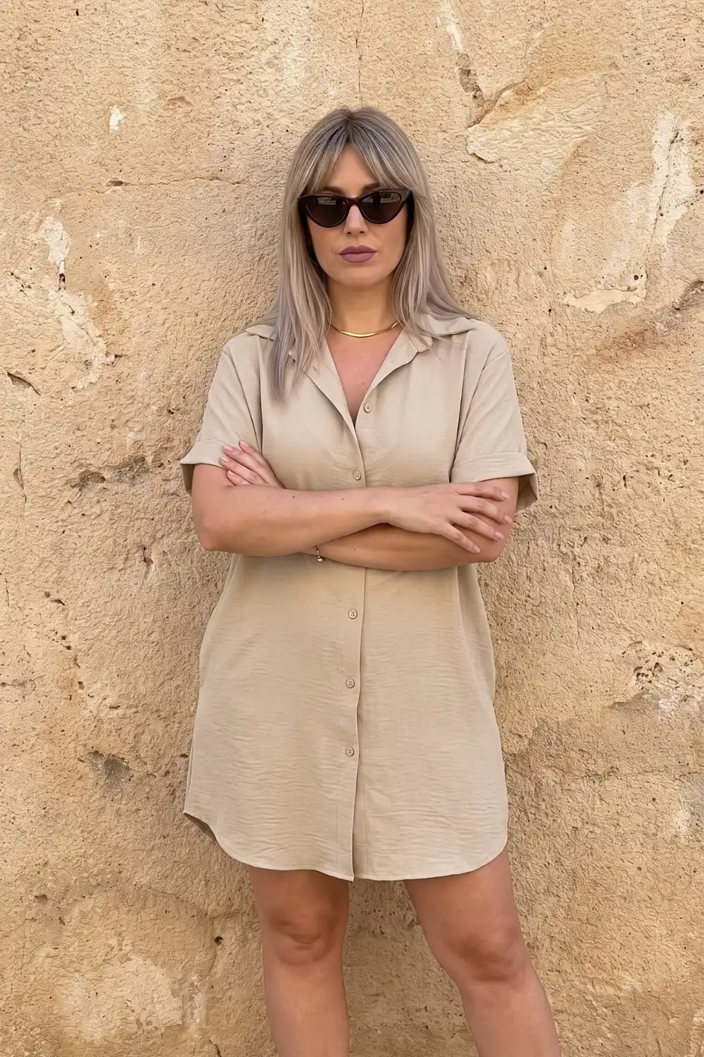 Woman wearing beige sand short sleeve linen mini shirt dress