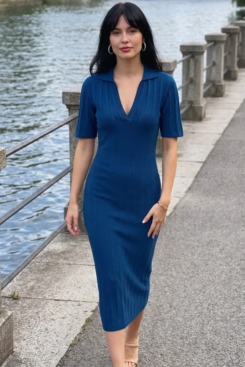 Woman in teal blue ribbed polo collar short sleeve fitted knit midi dress