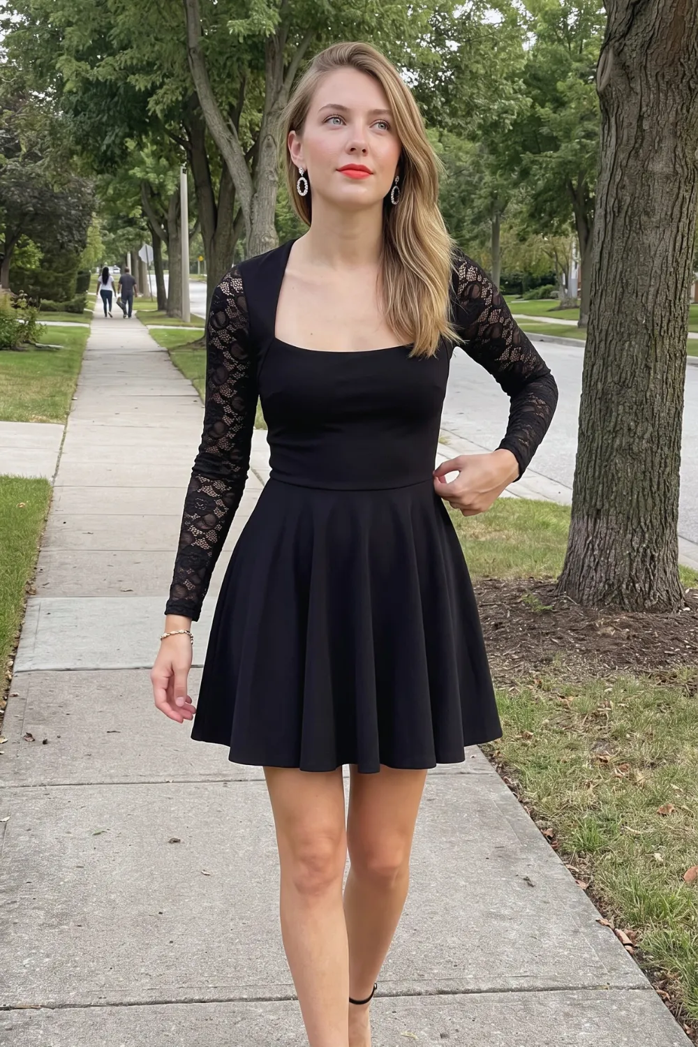 Woman in black lace long sleeve square neck fit and flare mini dress