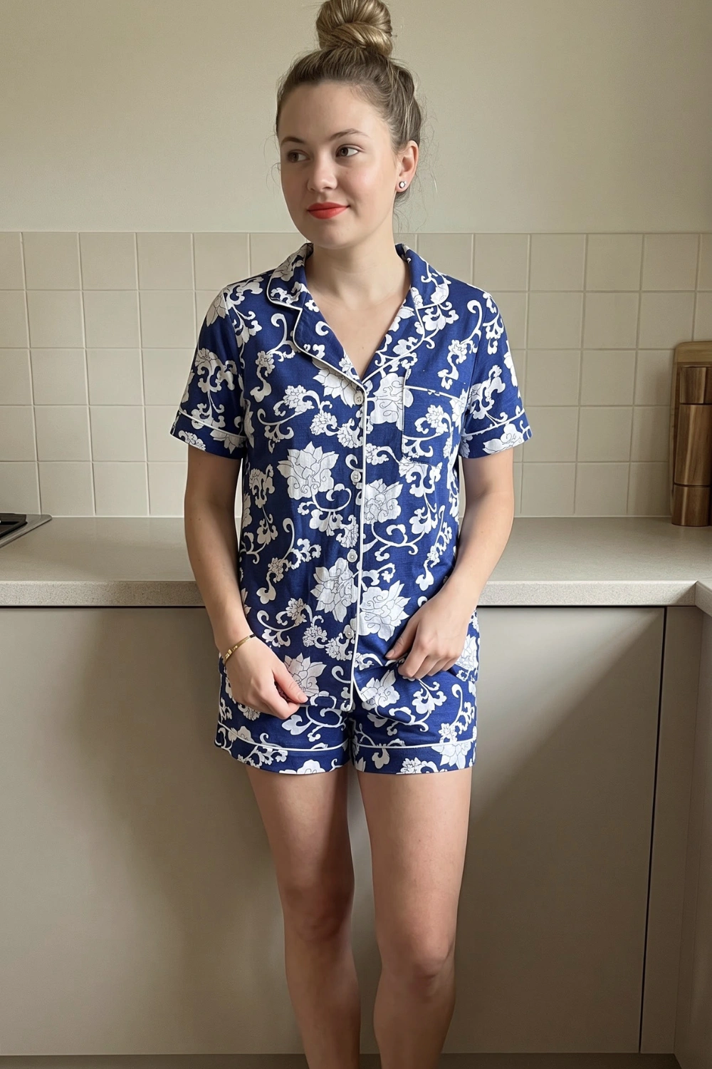 Woman in navy blue white floral baroque print short sleeve button down shirt and shorts pajama set