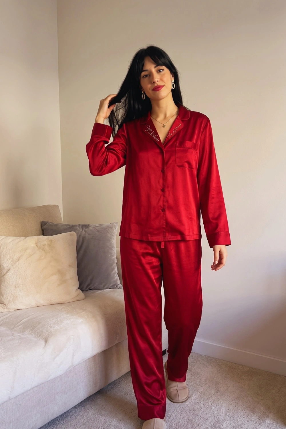 Woman in crimson red satin long sleeve button down shirt and wide leg pants pajama set