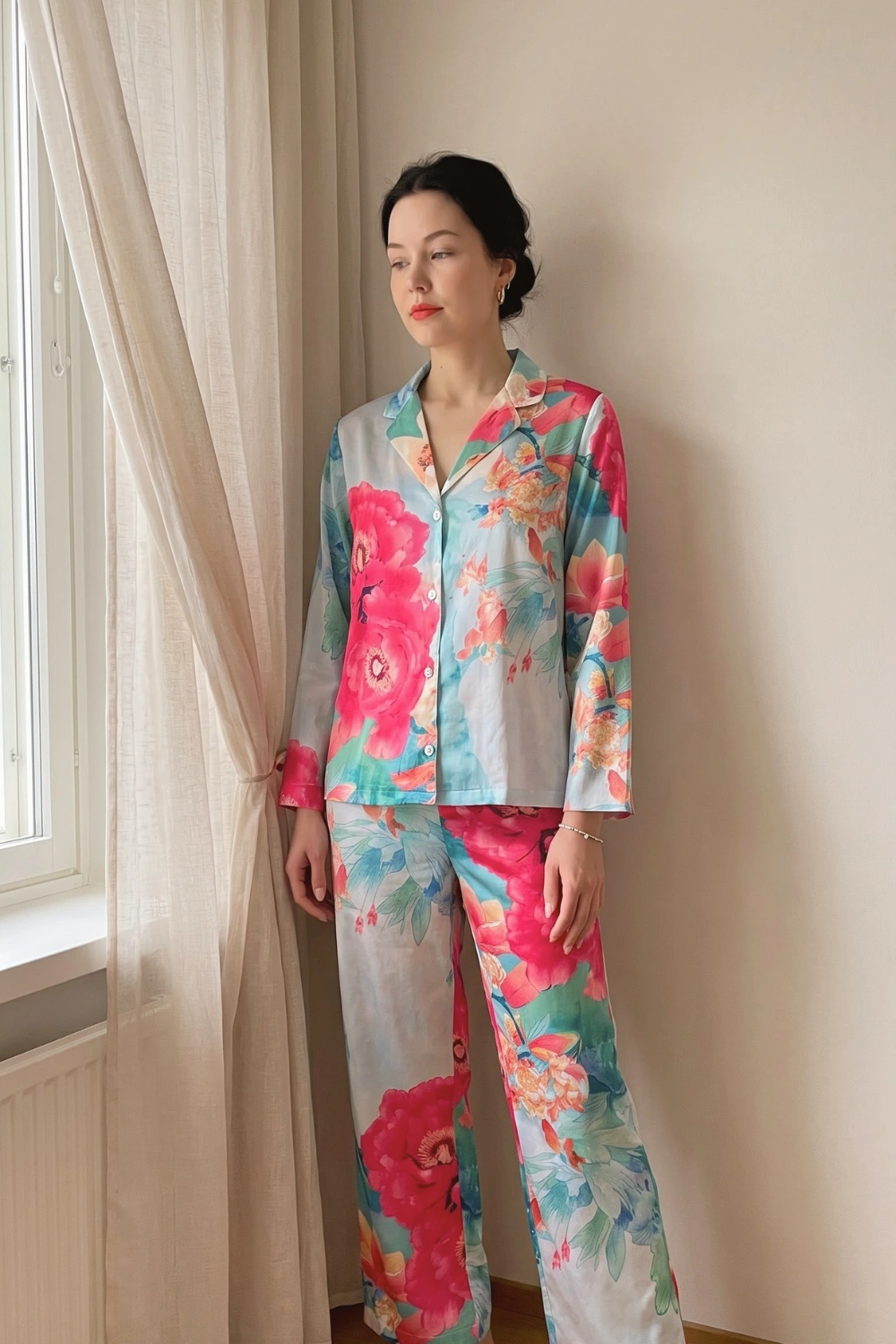 Woman in blue grey teal multicolour watercolour peony floral print satin long sleeve button down shirt and wide leg pants pajama set