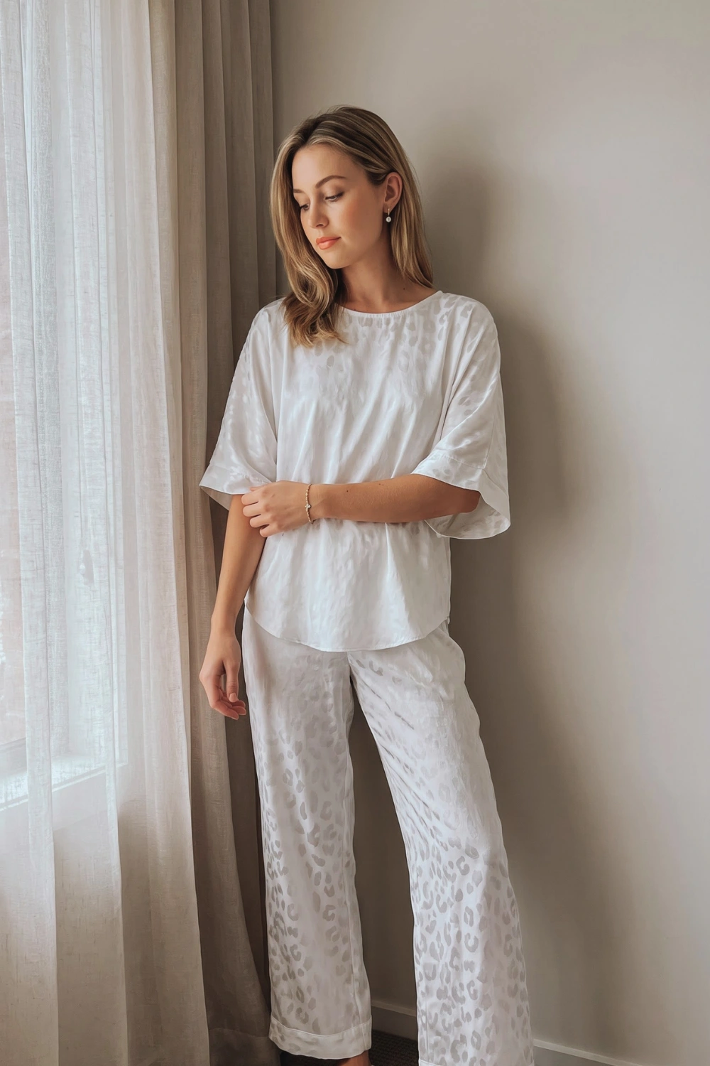 Woman in white jacquard leopard print oversized short sleeve top and wide leg pants pajama set