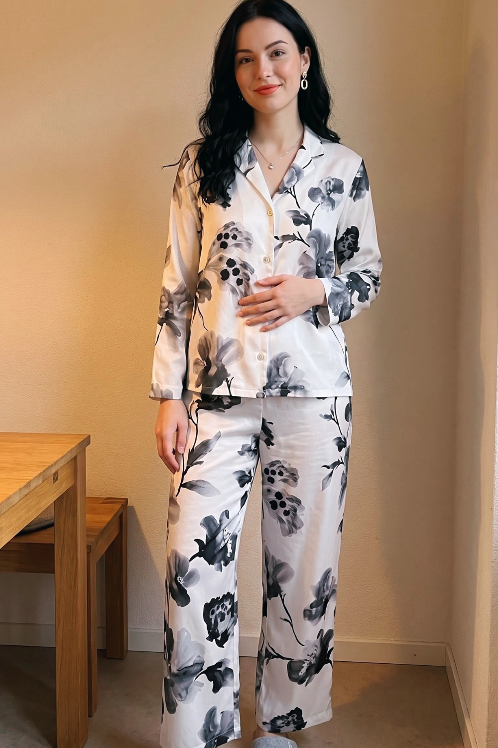 Woman in white black grey watercolour floral print satin long sleeve button down shirt and wide leg pants pajama set