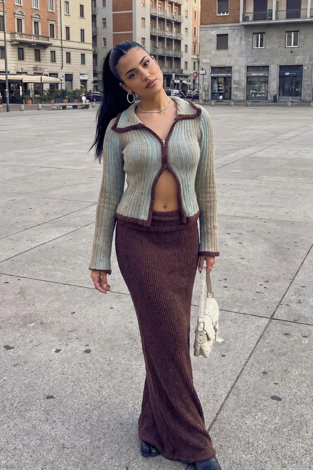 Woman in blue brown trim zip ribbed knit cardigan and chocolate brown ribbed knit maxi skirt